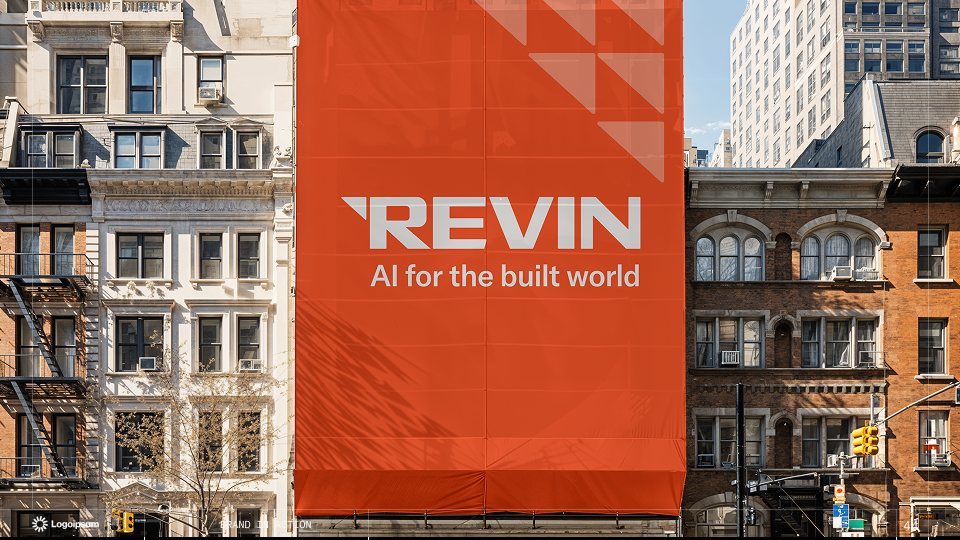 Revin brand banner on a city building: AI for the built world